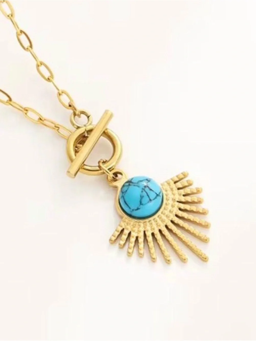 Gold Sunburst Pendant Necklace with Turquoise Stone